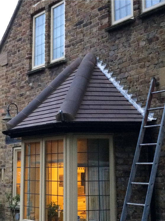 Bay window roof in plain tiles with new step lead flashing
