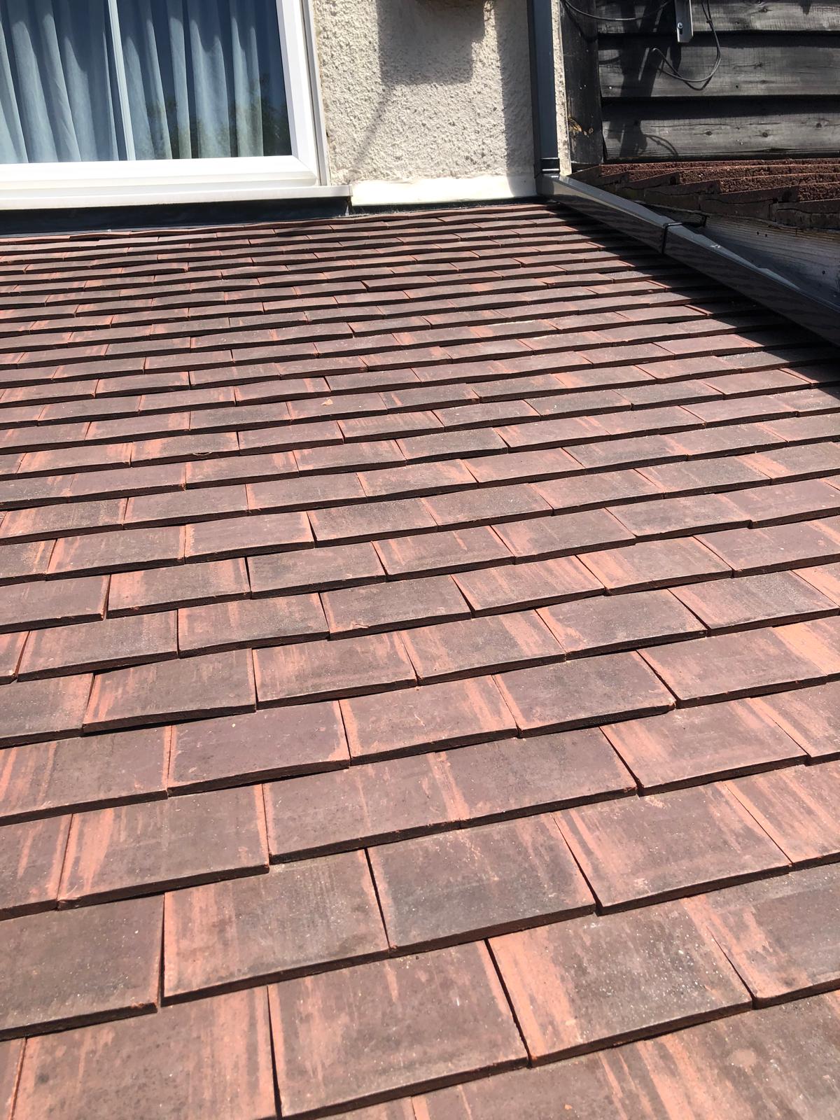 New extension roof in antique plain tiles