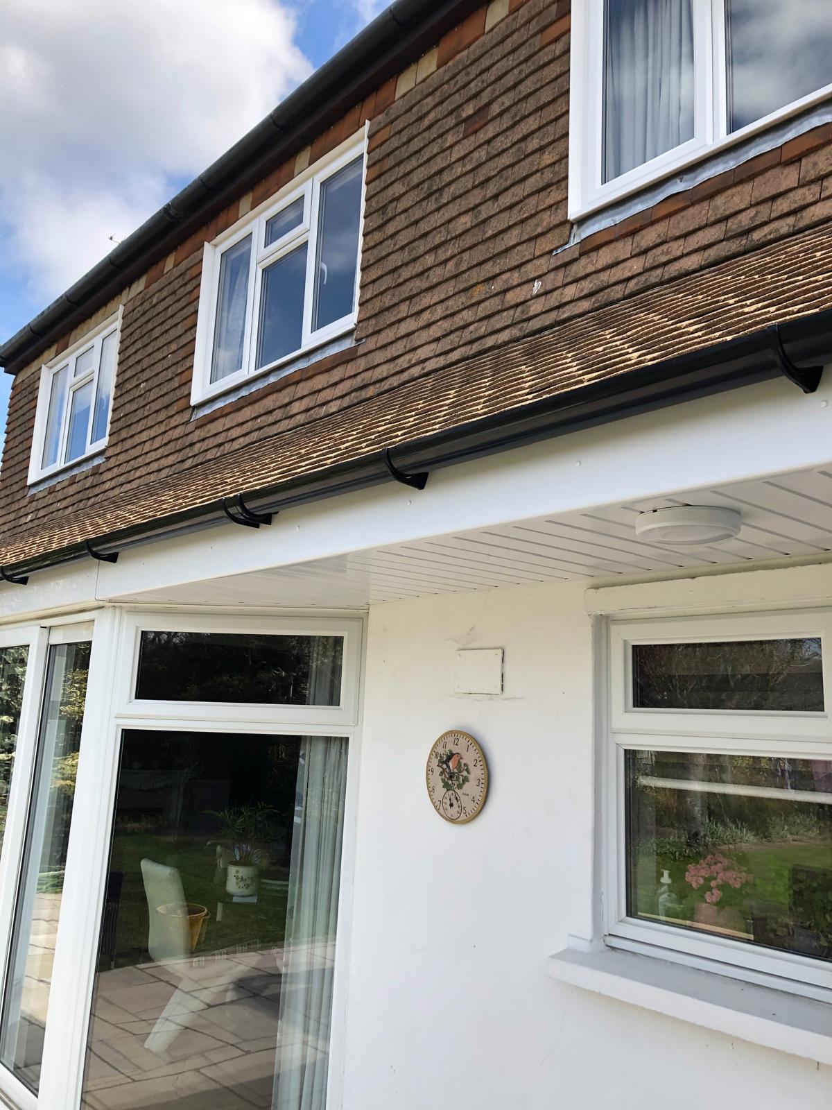 New white fascia & soffit with black half round gutter